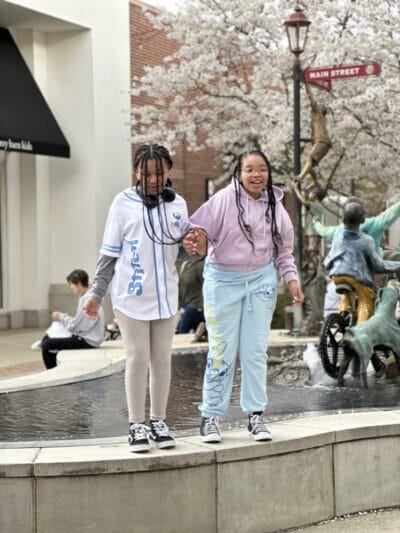 girls jumping in the street